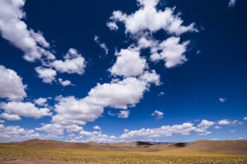Altiplano Vast desert landscape with blue sky and scattered clouds near San Pedro de Atacama and Fiambala.