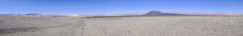 Around Antofagasta Landscape view of the desert near San Pedro de Atacama, with distant mountains and clear sky.