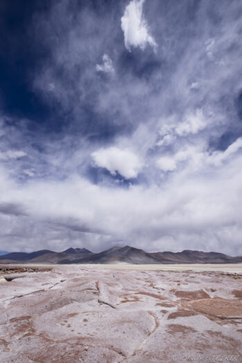 Salar de Talar Desert landscape with cracked ground and dramatic sky in San Pedro de Atacama, near Fiambala, Argent.