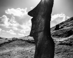 A playful sun and a tall Moai in Rano Raraku