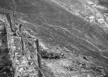 Wall of shame, on the South side, a slum.