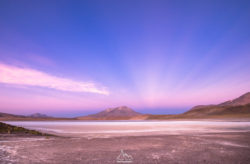 A stunning landscape image showcasing a peaceful lake scene with mountains in the background, perfect for nature and travel photography. Serene landscape photograph capturing a tranquil lake with mountains under a colorful sunset sky.